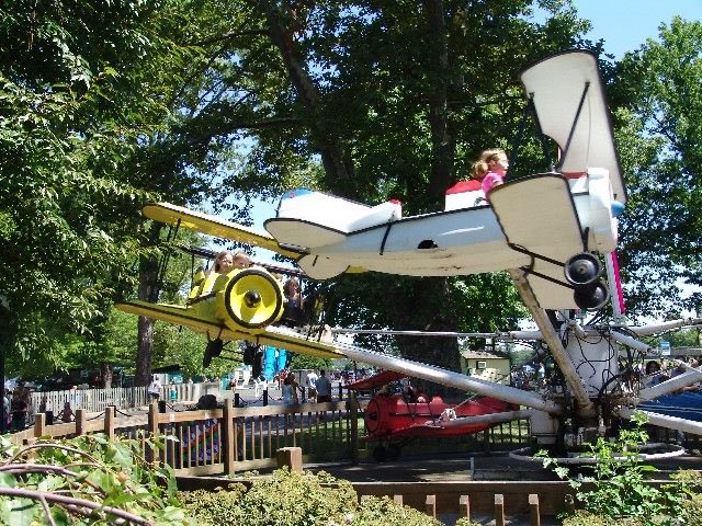 I FORGOT TO FINISH THIS LMFAO. ANYWAY One day i was working a little ride called airplanes. it was literally that- these little airplanes that went in a circle & they had a small lever the kid could pull to go up or down when the ride has started. Pic below is the planes going up