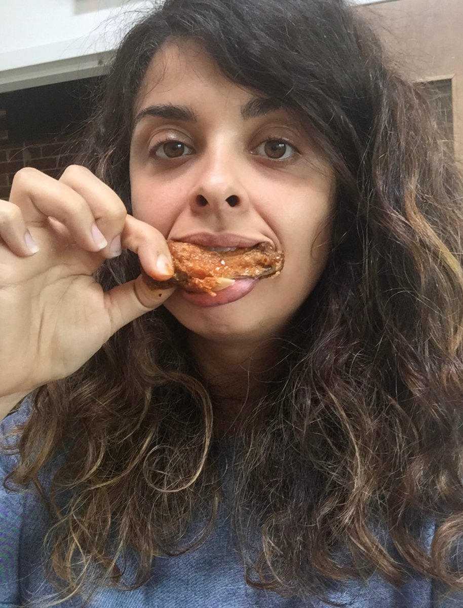 here’s me eating a buffalo wing, hope this helps