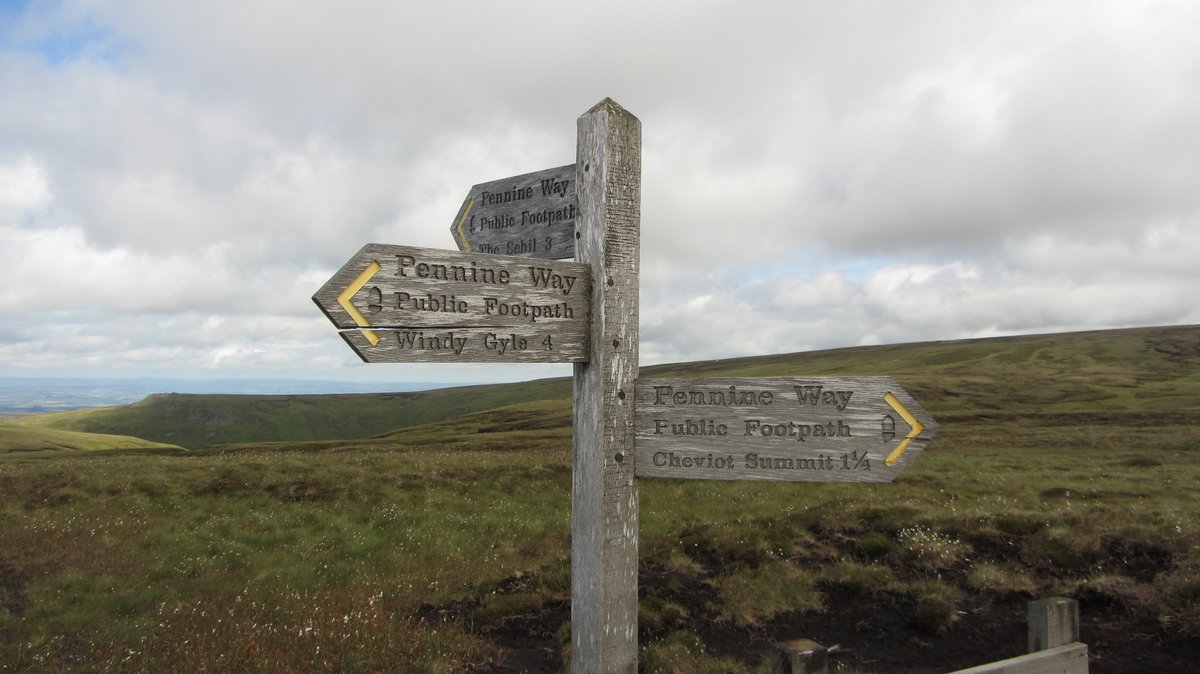 Day 3) cont:Flagstones paved the way to the highest point in Northumberland where I took a rubbing of The Cheviot's trig bracket set in it's whitewashed pillar 'S1560'. The path continued along a ridge to the Mountain Hut: some stones where etched like contours on a relief map.