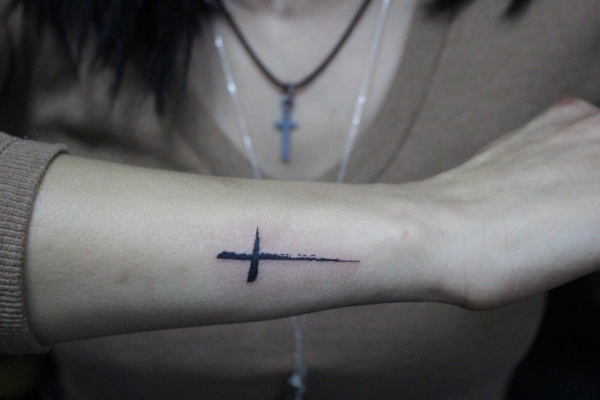 Small Plus Sign Tattoo
