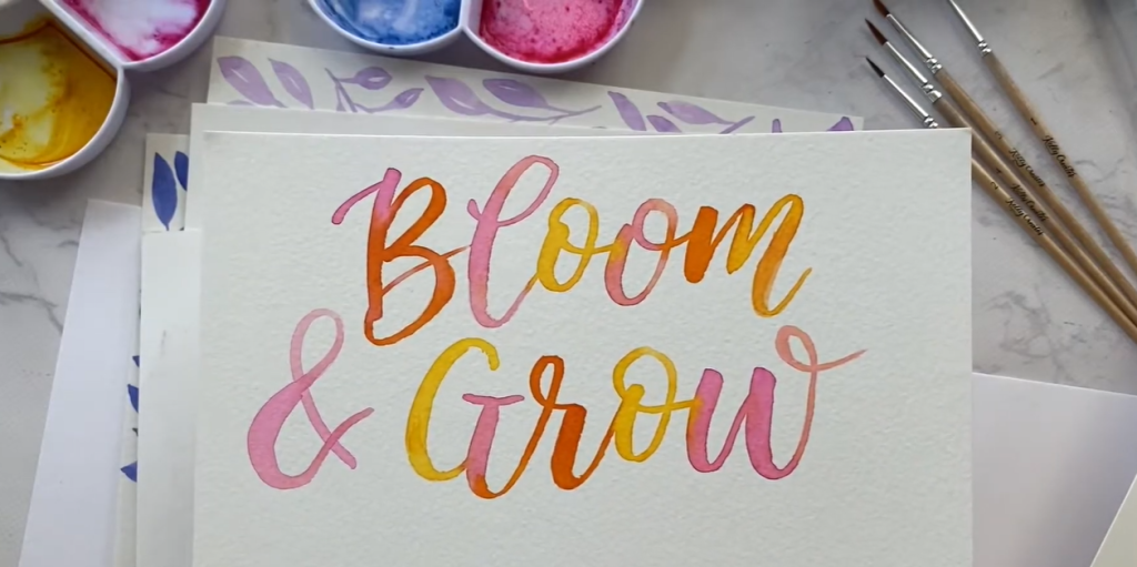 EPLdotCA's tweet photo. Looking for a relaxing, creative activity to do at home? Join local Edmonton artist and author of The Art of Watercolor Lettering @KellyCreates to get started with your own watercolor lettering practice! https://t.co/FjA33NcLbW https://t.co/Hkx2aigAi8