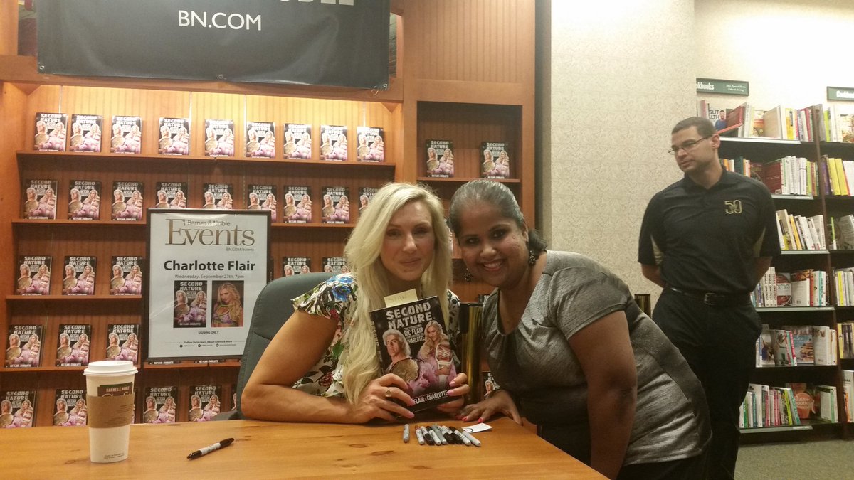 SiH0985's tweet photo. @MsCharlotteWWE I can't find my other pictures, but there's this one from your book signing in Orlando.  I also went to your Toys R Us signing during Orlando's Wrestlemania and I went to my first ever Wrestlemania in Orlando just to see you and Taker. https://t.co/VaeCWeTIIo