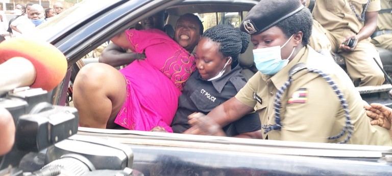 SharingUbuntu's tweet photo. Stella Nyanzi brutally arrested AGAIN! This time for protesting the extrajudicial killing of a Makerere University student by a paramilitary group. #Justice4Tegu https://t.co/fhQI7v3UGl