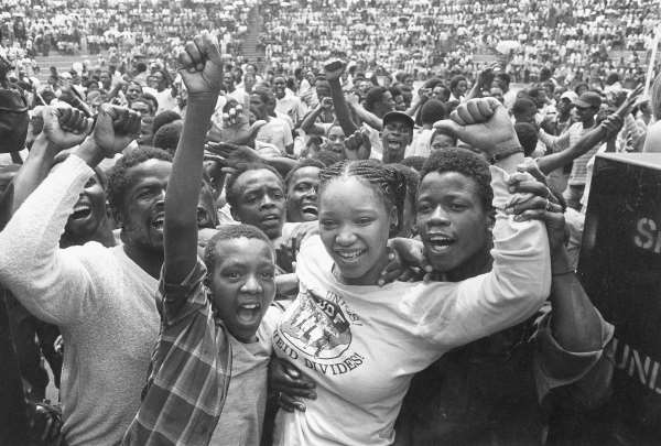 Zindzi Mandela being held up by ANC supporters after reading a message from her father Nelson Mandela during a rally organised by Cosatu. (Photo by Gallo Images/Sowetan)