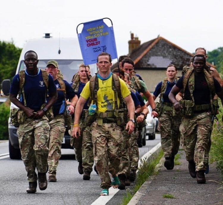 TheDizzyFitz's tweet photo. @10DowningStreet this is the barefoot soldier Chris who is marching 700 miles to raise awareness of his daughters condition. This is troops of Yeovilton giving a morale boost today as he broken- he is coming to see you, please see him #hopeforhasti https://t.co/Zgtr06143M