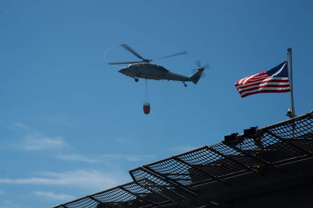flynavy's tweet photo. The Merlins of HSC 3 have been hard at work assisting USS Bonhomme Richard (LHD 6) Sailors and San Diego Federal Fire firefighters to contain the blaze aboard the ship. Naval Aviation will continue to be ready and able to aid in the fight. #BHR #FlyNavy #OneTeamOneFight #HSC3 https://t.co/uPJySws3oI