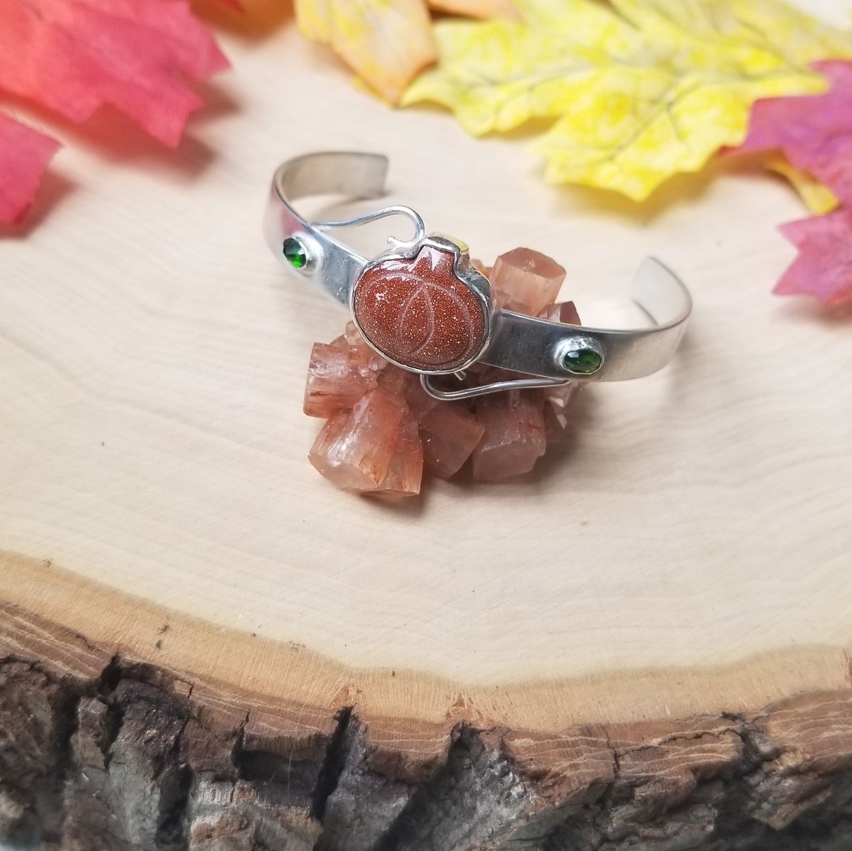 BLaceJewelry's tweet photo. The Pumpkin Patch Cuff 🎃
I am working in my autumn Collection so that I can have the pieces completed in time. This cuff features a carved goldstone pumpkin and 2 faceted chrome diopsides. 

#pumpkin #autumniscoming #readyforfall #autumn #fall #bracelet #cuff #jewelry #Silver https://t.co/rprihRPazz