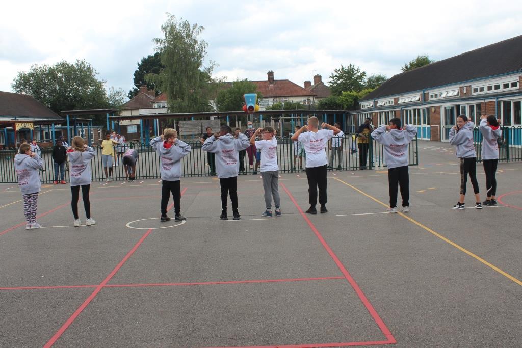 WPS_Success's tweet photo. Year 6 doing some socially distant modelling of their leavers hoodies and t-shirts - just arrived! https://t.co/WOFQGXZ0NQ
