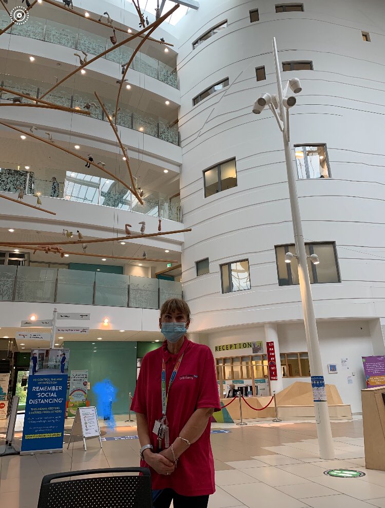 VolunteeringAH's tweet photo. Jacqui is at hand at 1 of the hygiene stations @AlderHey to greet you. We know the masks may look a little scary but under that mask she is smiling a huge smile of welcome, as all our brilliant volunteers do. #KeepingEveryoneSafe #WearAMask #KeepingSmiling https://t.co/7imdwhOOGV