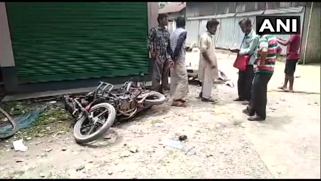 ANI's tweet photo. West Bengal: Vehicles vandalised in Cooch Behar's Tufanganj during a clash allegedly between Trinamool Congress and BJP supporters over the 12-hour 'bandh' called by BJP to protest the death of their MLA Debendra Nath Roy whose body was found hanging in Balia. https://t.co/6Q9DeH4DWC