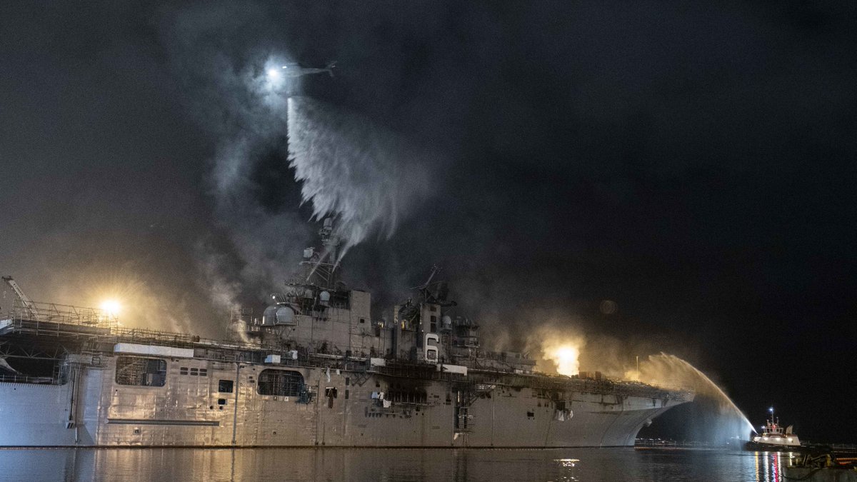 defpostmedia's tweet photo. A helicopter from #HSC3 combats a fire aboard #USNavy amphibious assault ship #USSBonhommeRichard (#LHD6) at @NavBaseSD, July 14. (USN Photo by MC3 Garrett LaBarge) https://t.co/ILjhxEmAZv