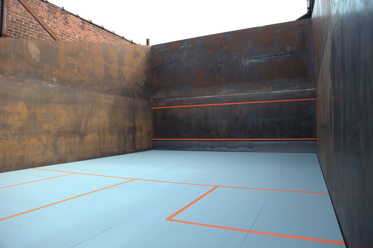 SquashRepublic's tweet photo. STEEL SQUASH COURT!

We would LOVE to play on this court in #Maspeth, NY. The sound of the ball hitting a steel wall! Wouldn't you?

It's on the property of Maspeth Welding and is being used by the director, Robert Gibralter, to teach his staff how to play. 
 
/2 https://t.co/vQwq1IBmae