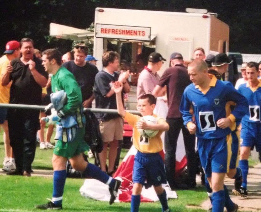 AFCWimbledon's tweet image. Following our request earlier for your pics from that historic match day at Sandhurst, Michael Lonergan posted this image on Facebook with the message: "My boy leading the teams out. Proud Dad." #wearewimbledon