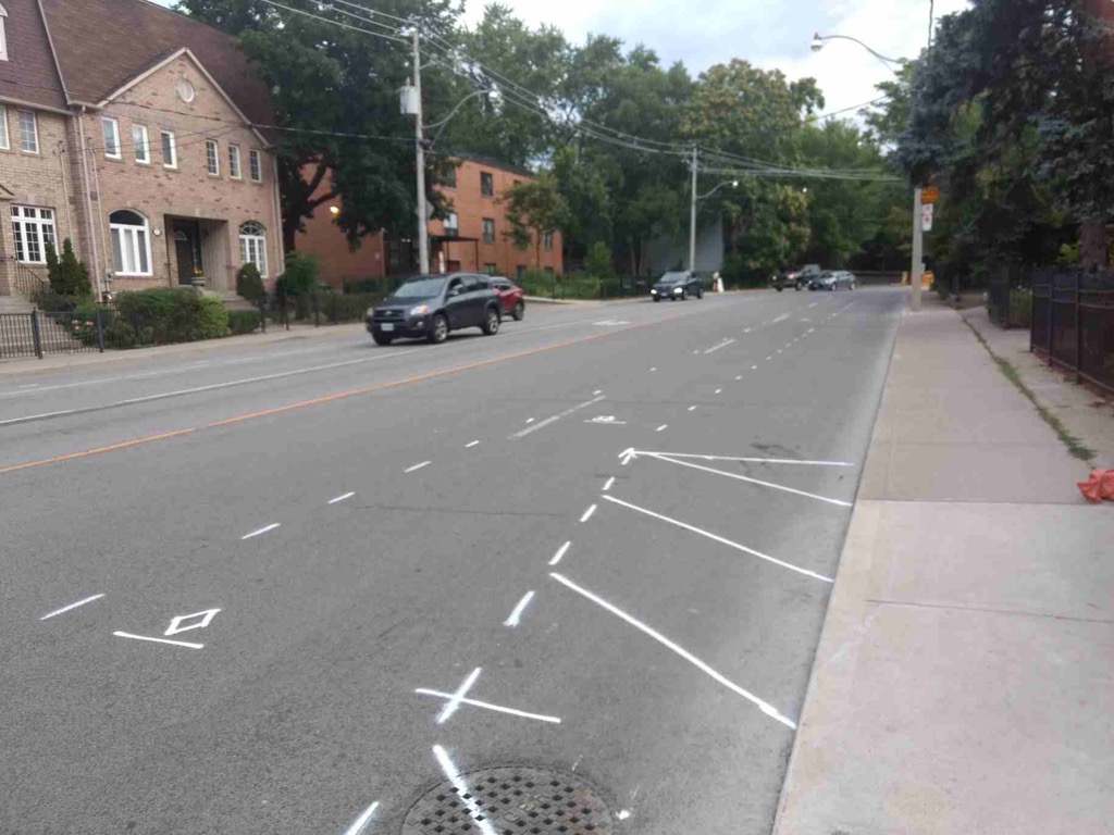 CycleToronto's tweet photo. Pre-markings are on the road for Bayview/River #ActiveTO temporary bike lanes. These will connected the existing River bike lanes to the multi-use paths on Rosedale Valley and and beside Bayview in the Don Valley. #BikeTO https://t.co/1JI4Vqf1sw