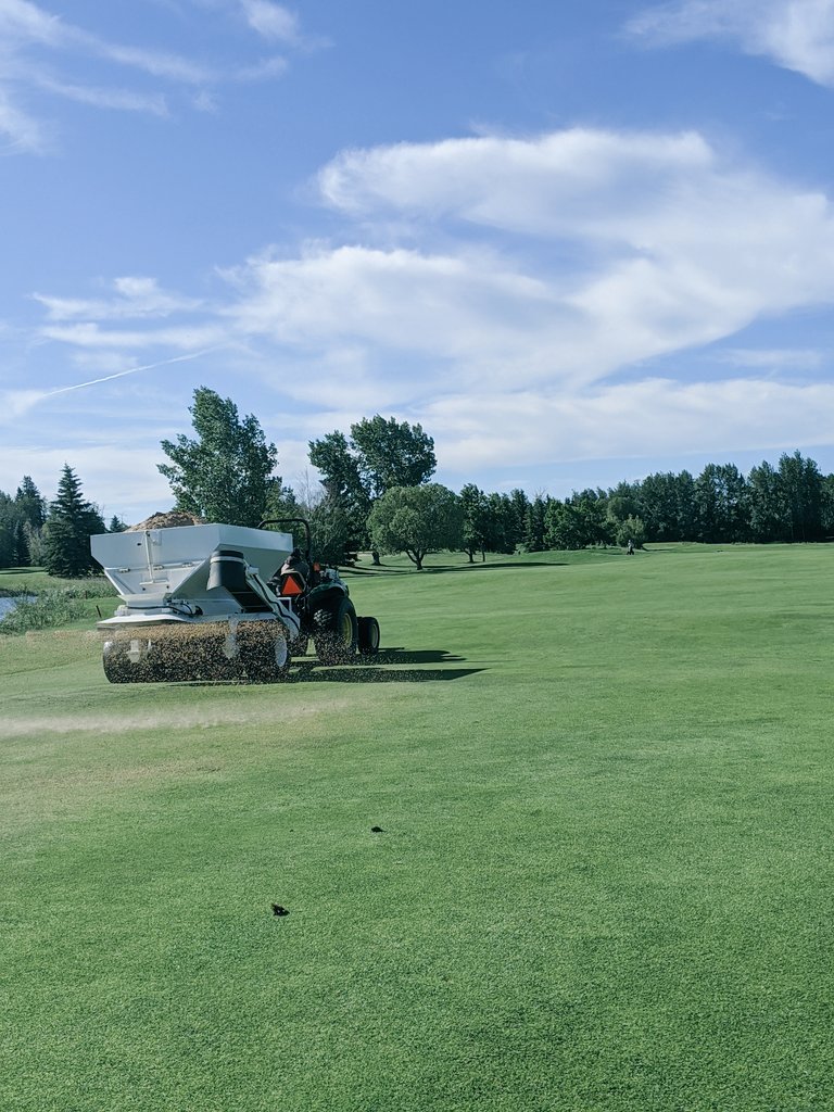 Finally dry enough for a fairway topdress.  Should take a couple days to finish if the weather holds up. #PClubTurfCare
