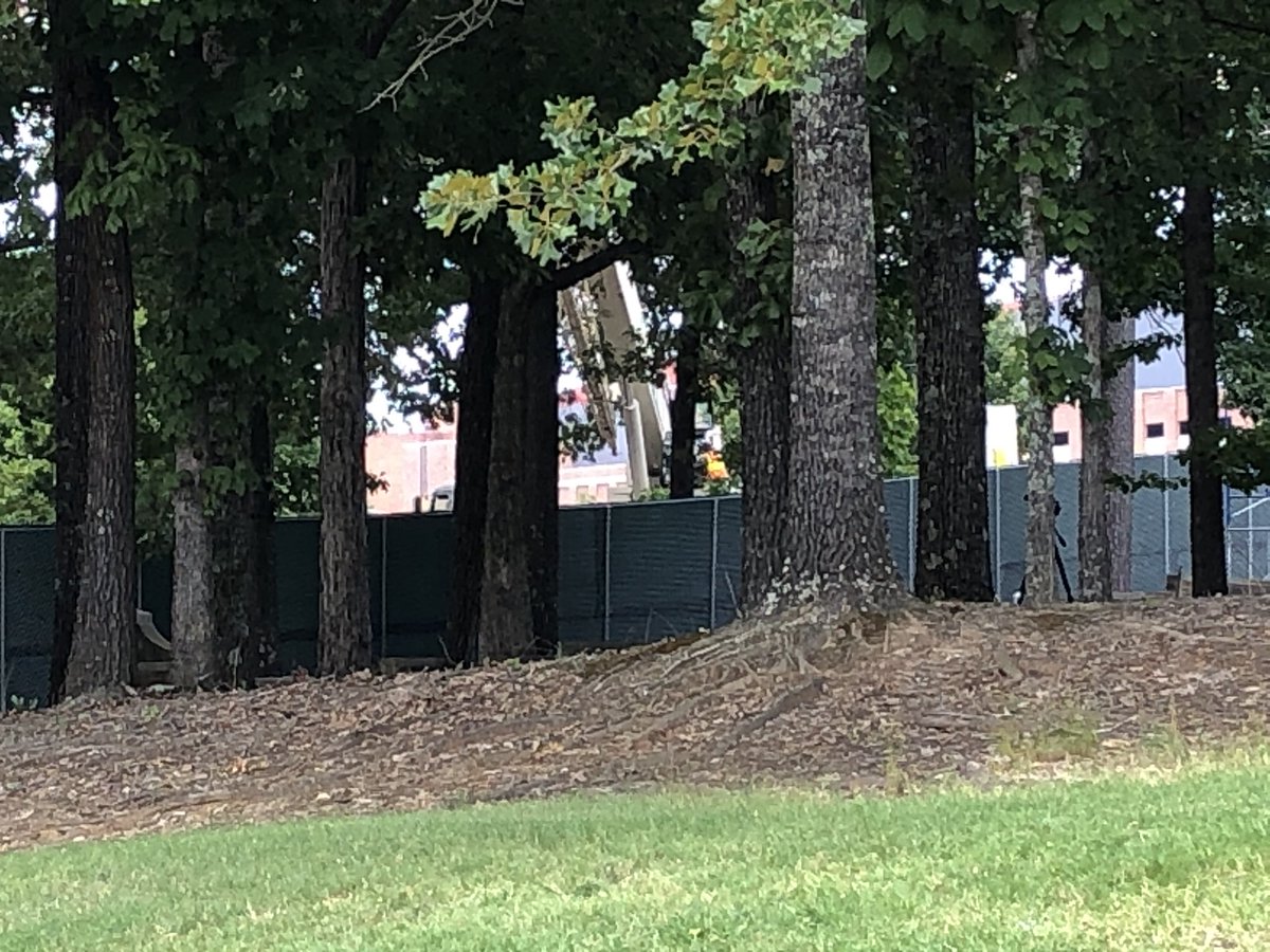 MDOT_DKenney's tweet photo. Ole Miss moves confederate monument from the circle in the center of campus,to the confederate cemetery on the south side of campus.  Both locations with high fences so you can’t see the work being done. https://t.co/INp12dnwMx