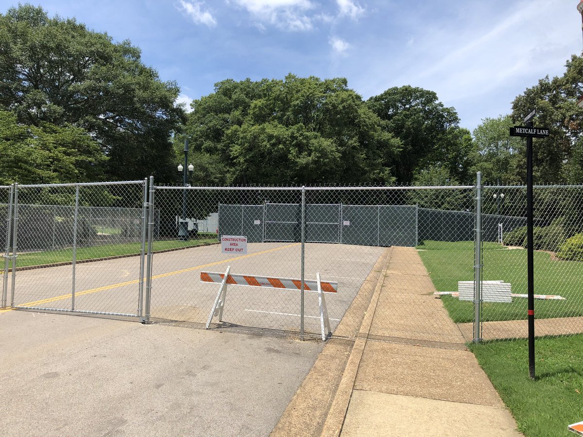 MDOT_DKenney's tweet photo. Ole Miss moves confederate monument from the circle in the center of campus,to the confederate cemetery on the south side of campus.  Both locations with high fences so you can’t see the work being done. https://t.co/INp12dnwMx