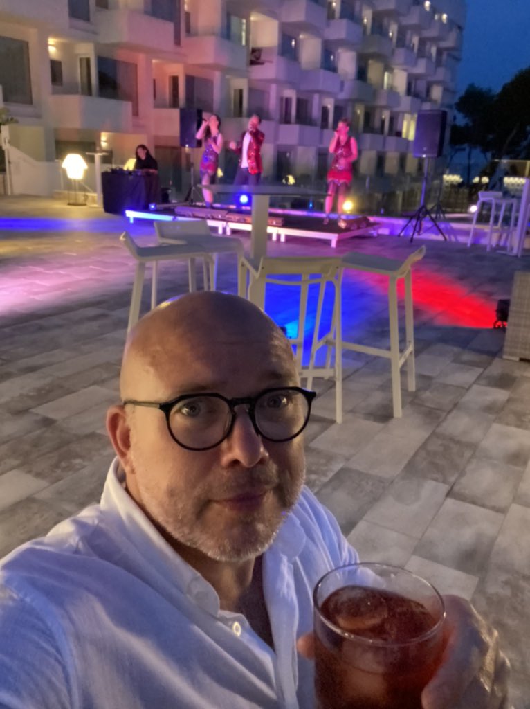 john7richardson's tweet photo. @RugbyPodcast first TUI flight out of Manchester a Negroni on a rooftop bar in Ibiza. Flying the flag. Lovin the pod. https://t.co/mgHqoT0Bii