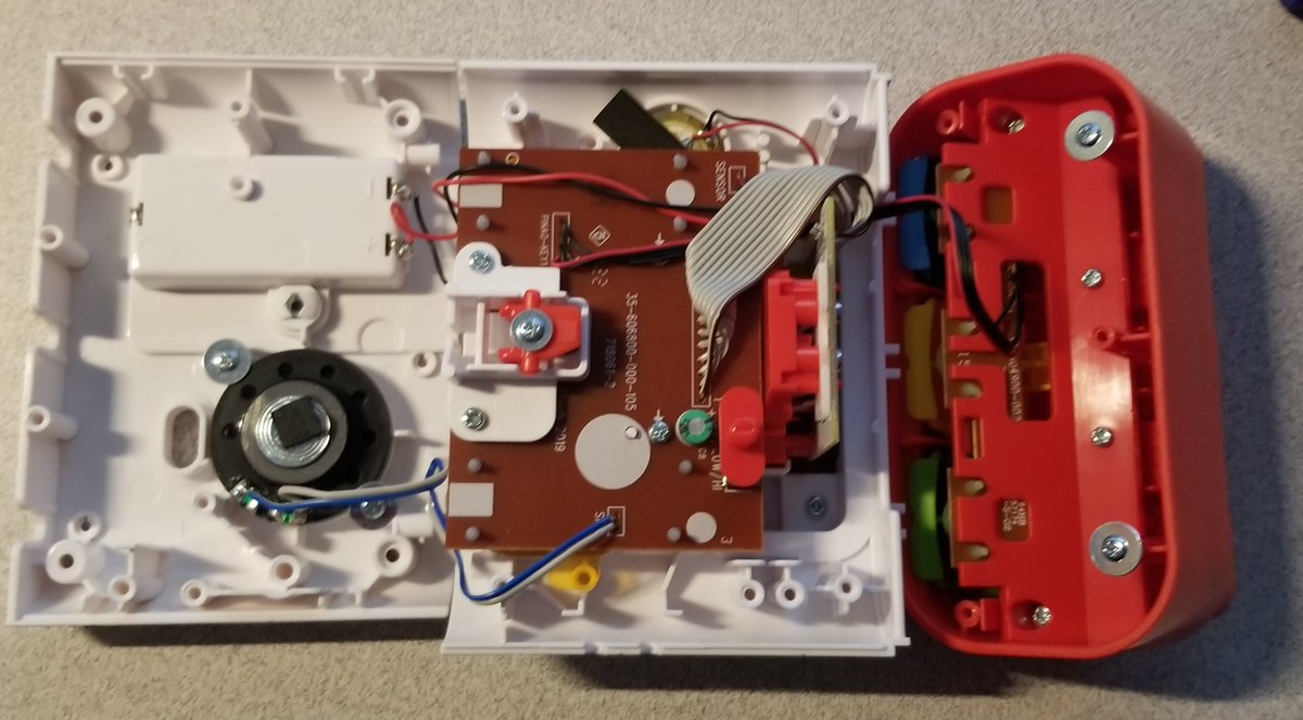 4 more on the back (and two underneath the red bit) and it opens up.The left most piece is the back: it's just a speaker and battery compartment.Middle PCB is the main one, the right part is just those 3 buttons.