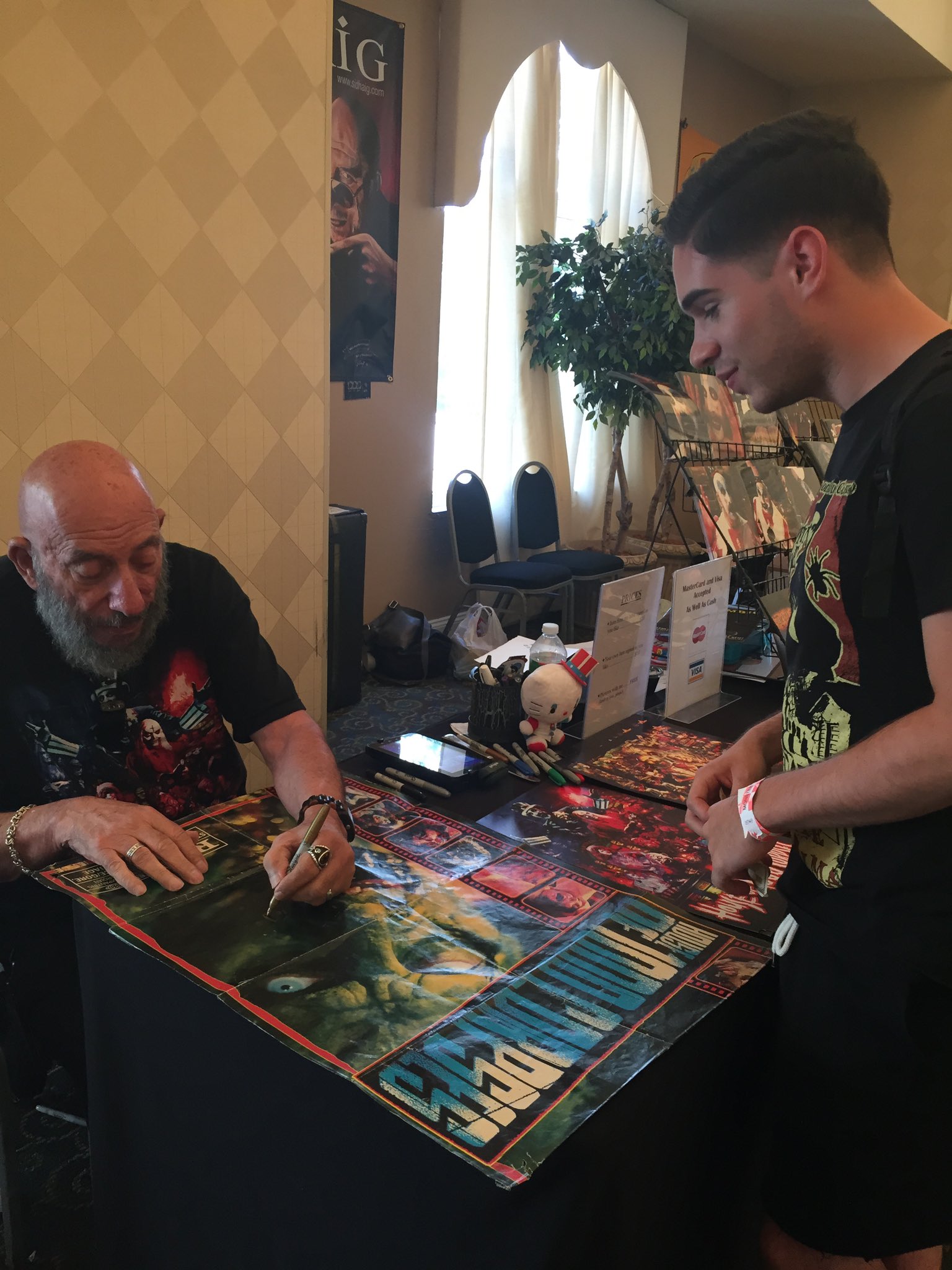 Happy birthday to Sid Haig. 
Here I am meeting him at monster mania a few years ago 