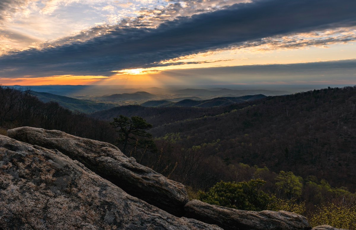 Interior's tweet photo. Feel the first warm rays of the sun on your face as you sit on the rugged ridges @ShenandoahNPS #Virginia https://t.co/FhN8W2qSNv