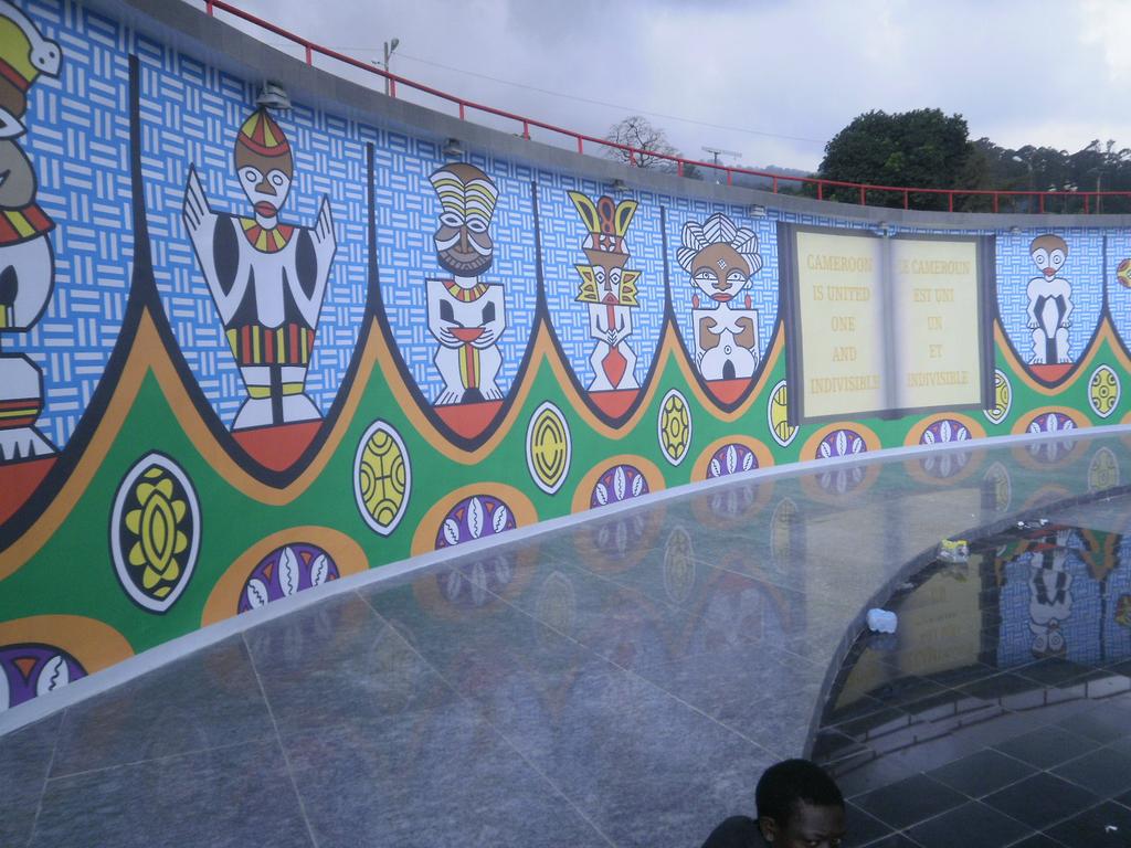 1st frame The Yaounde reunification Monument constructed in the 1970s to memorialize the post-colonial merging of British and French Cameroon. 2nd and 3rd frames Buea reunification monument unveiled 19/2/2014 commemorating the 50th anniversary of Cameroon's independence