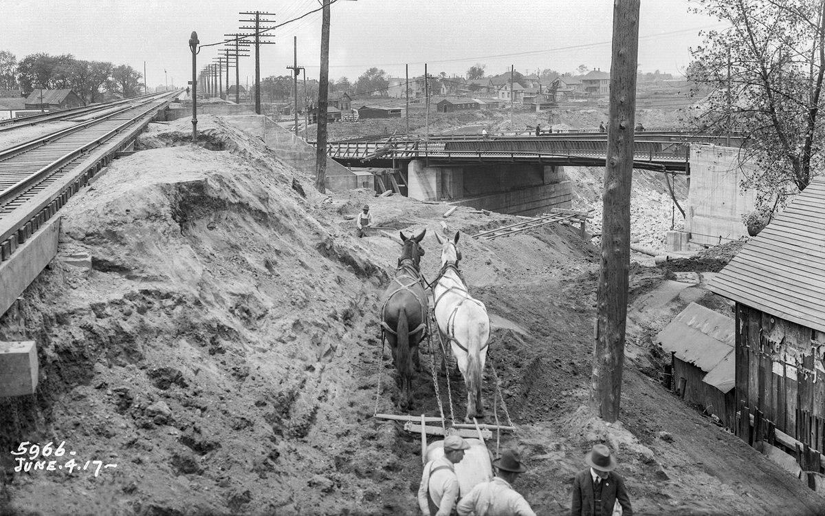 MWRDGC's tweet photo. Historical Photo of the Day: Construction of the Cal Sag Channel in Blue Island, Illinois, on June 4, 1917, looking SW from the Chicago, Rock Island and Pacific Railroad showing the Western Ave Bridge @blueislandcity @calsagtrail @ForgottenChi #rockislandline #allinillinois https://t.co/jh0PwtwBpA