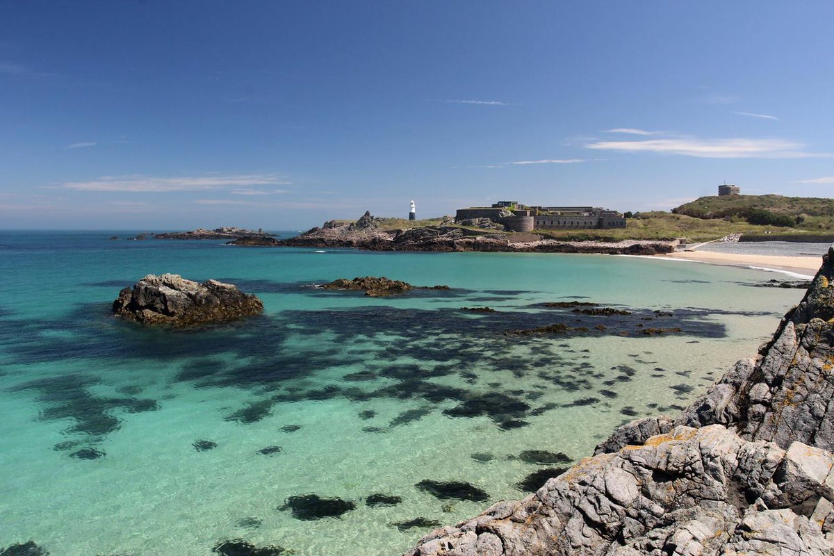 Alderney. This is in the Channel Islands. It was invaded by the Germans in WW2 and has lots of forts and bunkers. It also has incredible sea views, beaches, and great seafood. Inject it into my veins.