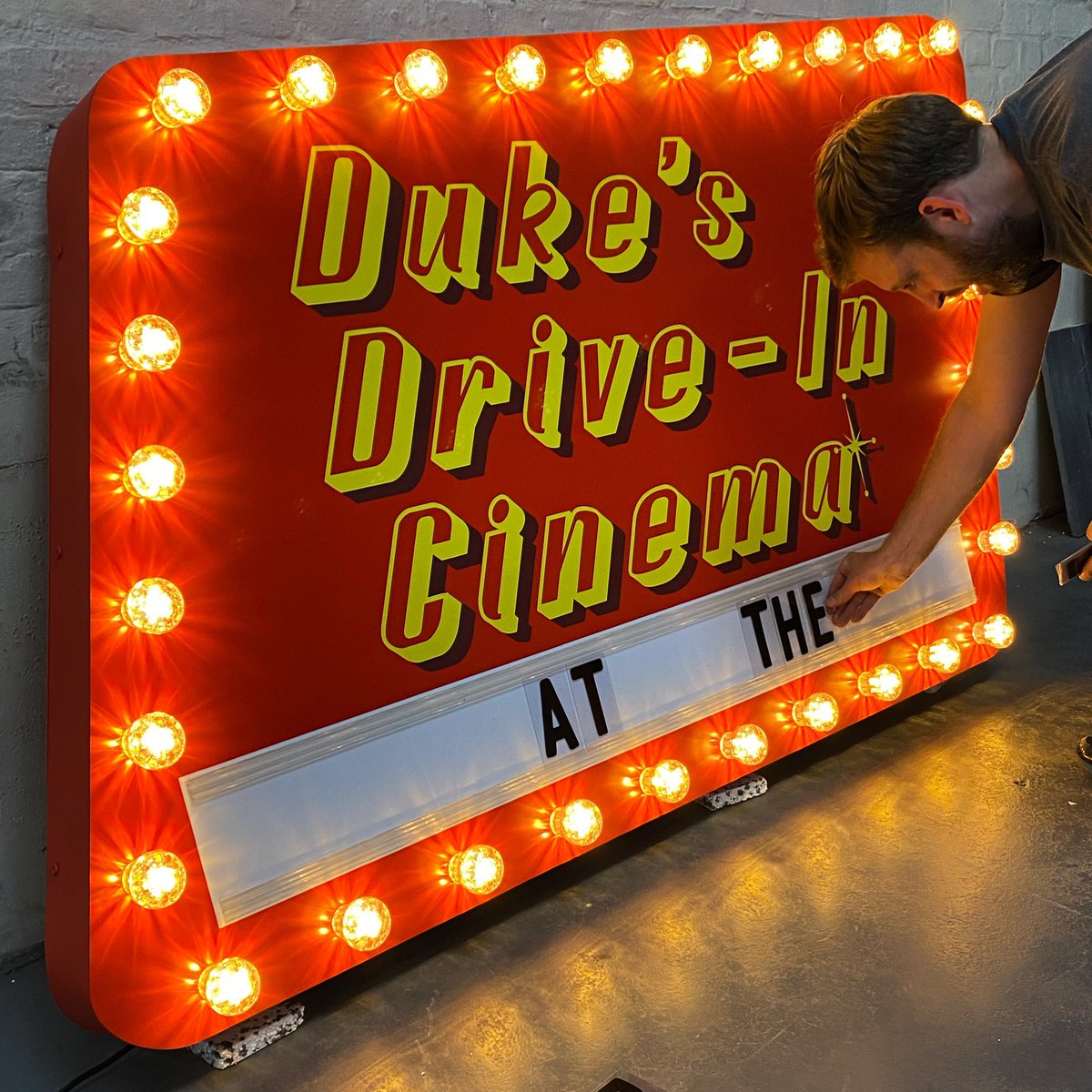 GoodwinDesign's tweet photo. Duke’s drive in cinema sign off to its new home today #signswithsoul https://t.co/p3E1Gbuj38