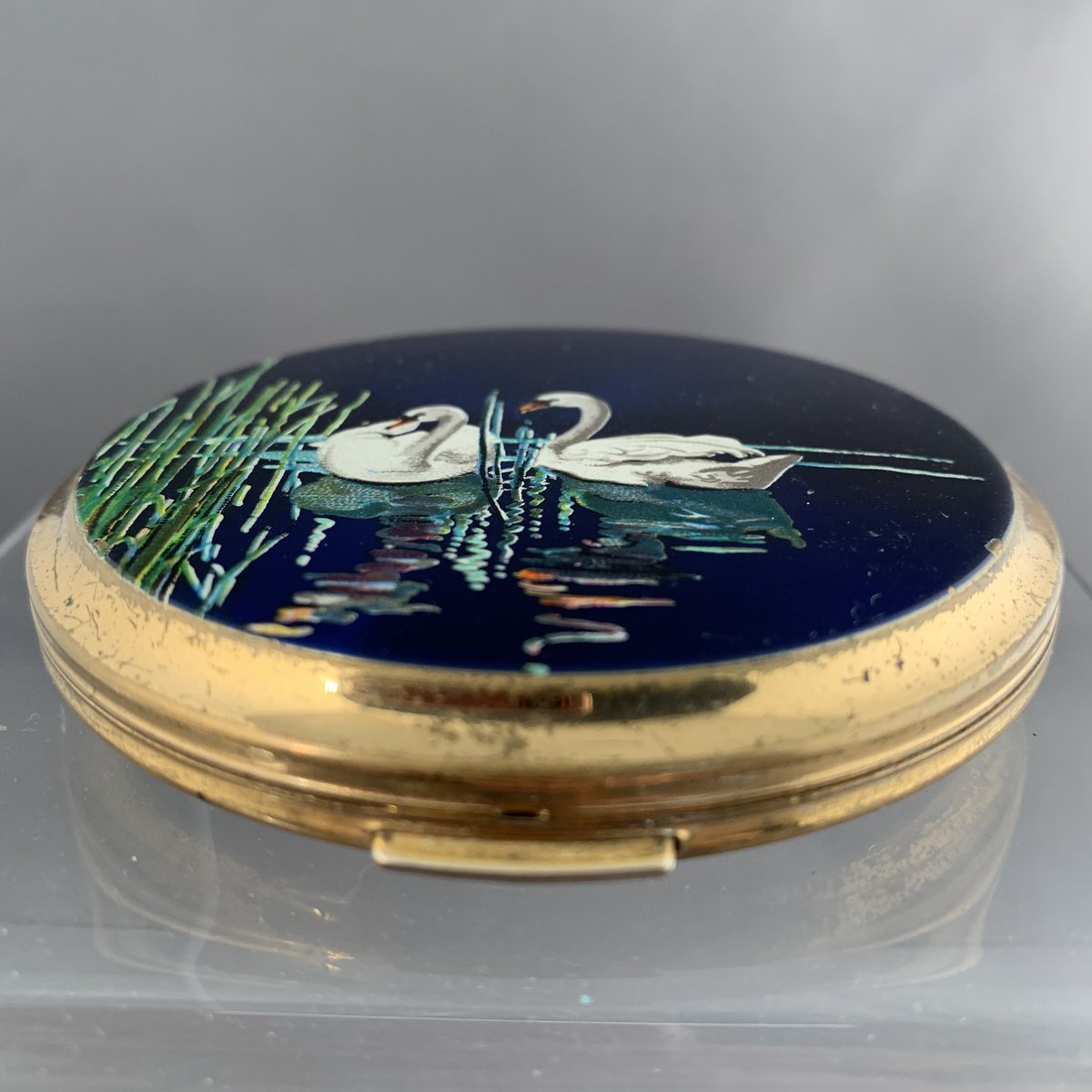 Next up: This beautiful ornate compact, decorated with two swans on lake.Give it a like or comment ‘Museum’ if you believe it’s part of our accessioned collection