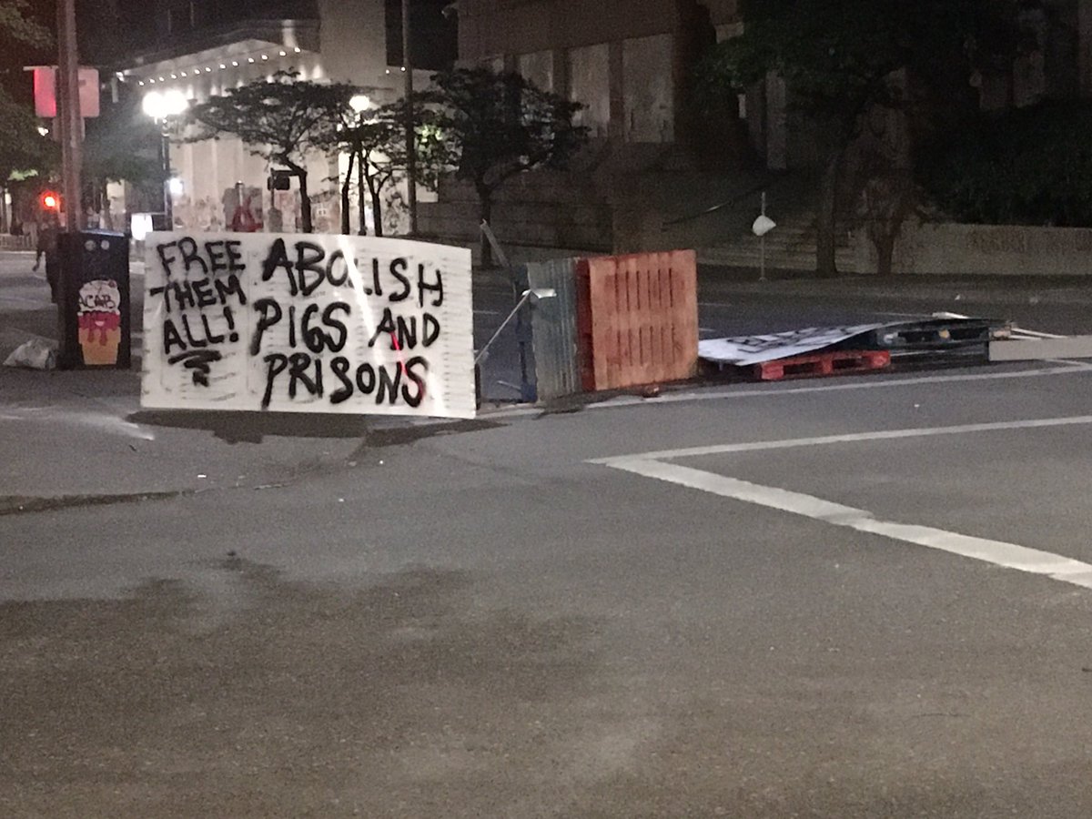 GenevieveReaume's tweet photo. We’re #LiveOnK2 in downtown #Portland this morning where a group is trying to establish a so-called #autonomouszone. @PortlandPolice attempted to clear it overnight, but the group returned. Here is what’s left of barricade at SW 3rd&Madison. #portlandautonomouszone https://t.co/q6kCetW0Re