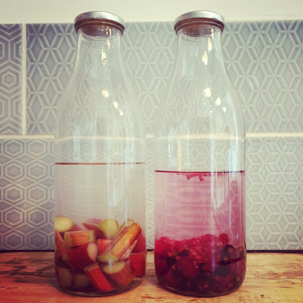 GeorgianCottage's tweet photo. First batches of this year's gin stewing #georgiancottage #gin #rhubarbandgingergin #raspberrygin #homegrown #isitreadyyet https://t.co/hxfrFSwc2C