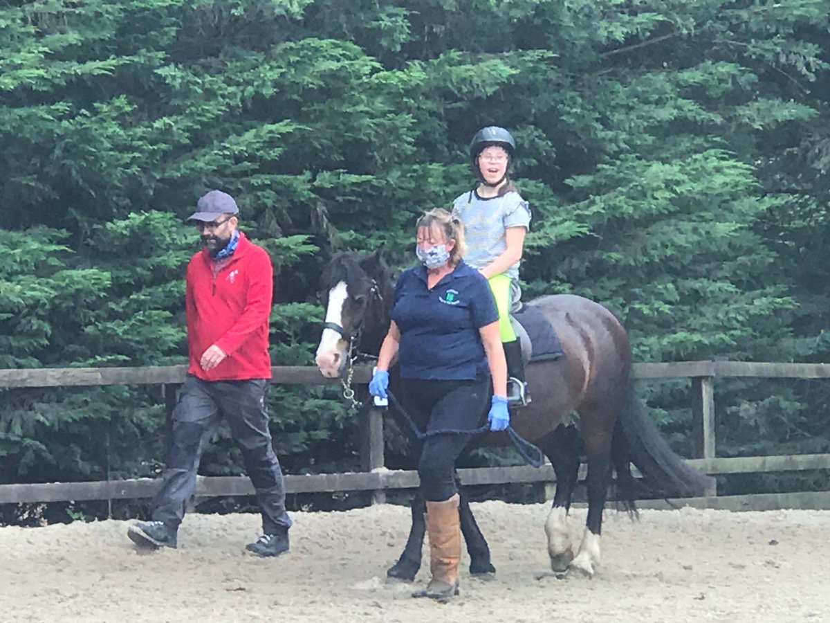 Rosswayrda's tweet photo. Ellie super happy to be back riding her beloved Coco! Note her dad as Volunteer deluxe!! https://t.co/N6S3UtBS64