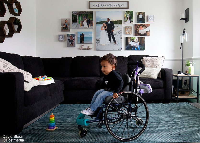 Kaysen Martin makes his way through the family living room and past a wall of family photos. His family wants AHS to cover a $2.8 million drug to treat the toddler's rare motor disease. edmontonjournal.com/news/local-new… #yeg