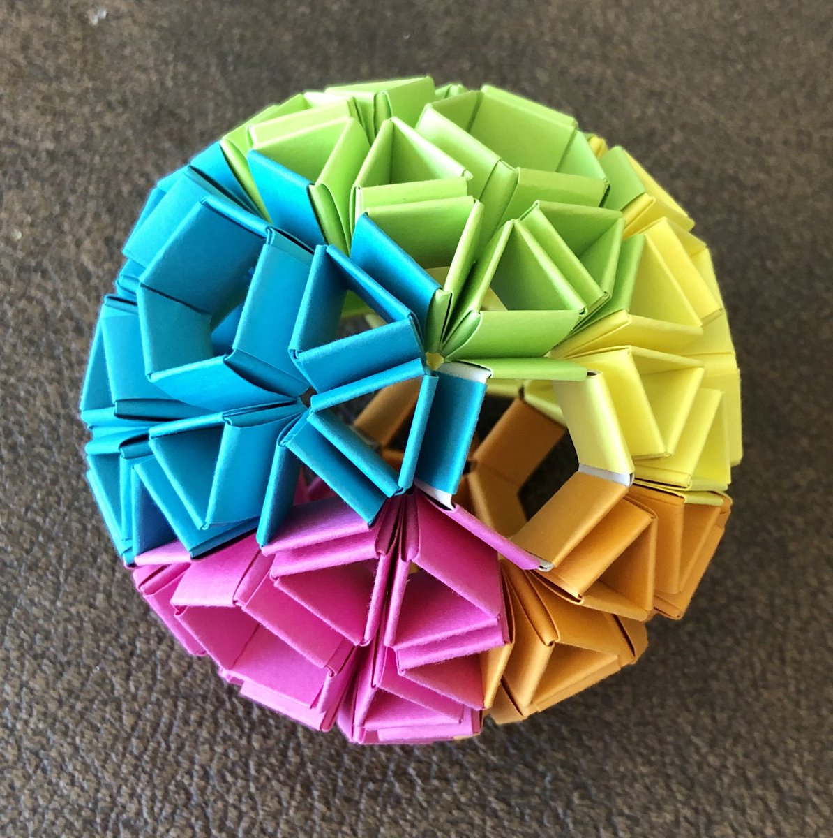 Geometiles's tweet image. My personal #MathArtChallenge has been to find a pleasing coloring scheme for the #snubdodecahedron that highlights its #chirality and #rotationalsymmetry. Sharing one of my attempts as part of  #mathphoto20. Made with paper strips, no glue. #snapologyorigami #MTBoS #iteachmath