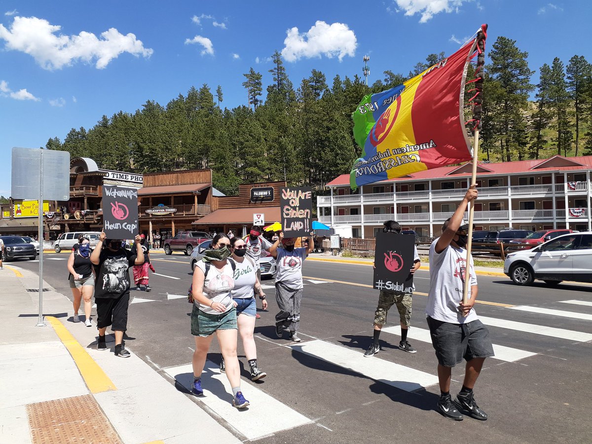 More protesters march through Keystone. Seems like several small groups of protesters here, loosely spaced. Police are following them through town.