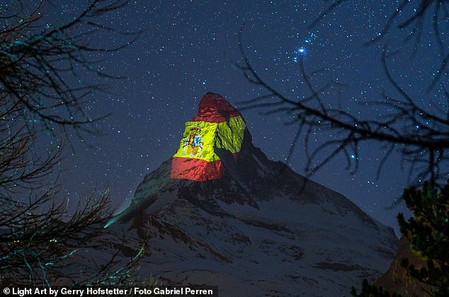 MatterhornTh most famous mountain in Switzerland. https://en.wikipedia.org/wiki/Matterhorn  https://internewscast.com/us-and-uk-flags-are-projected-onto-matterhorn-in-swiss-alps-for-coronavirus-solidarity/