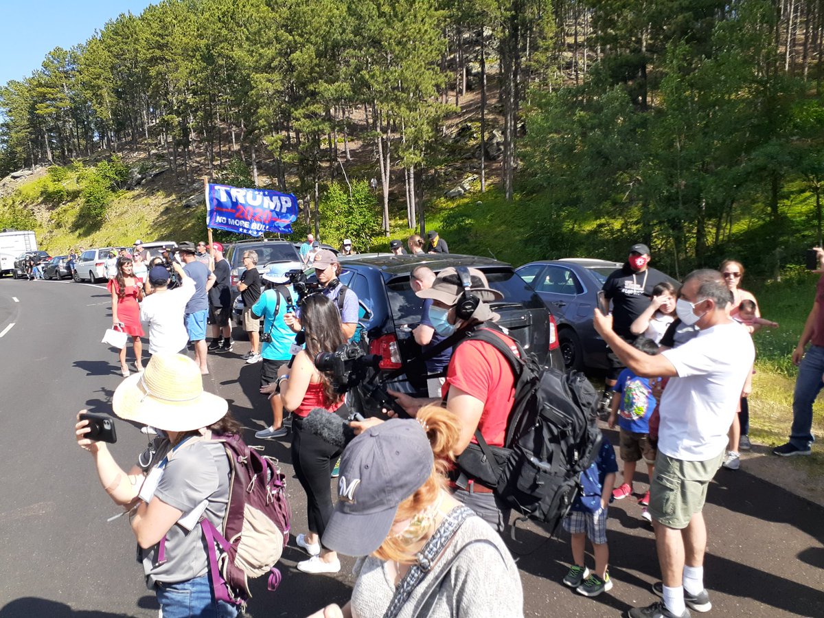 I've been pushed to the side of the protest by police, with other media, counter-protesters and some people with tickets to the event. Video isn't posting to Twitter due to cell bandwidth issues.