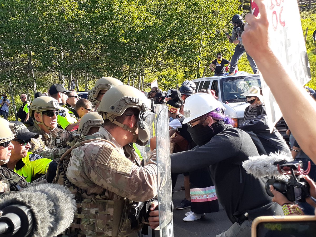 National Guard takes the van line. Some protesters getting pepper sprayed.