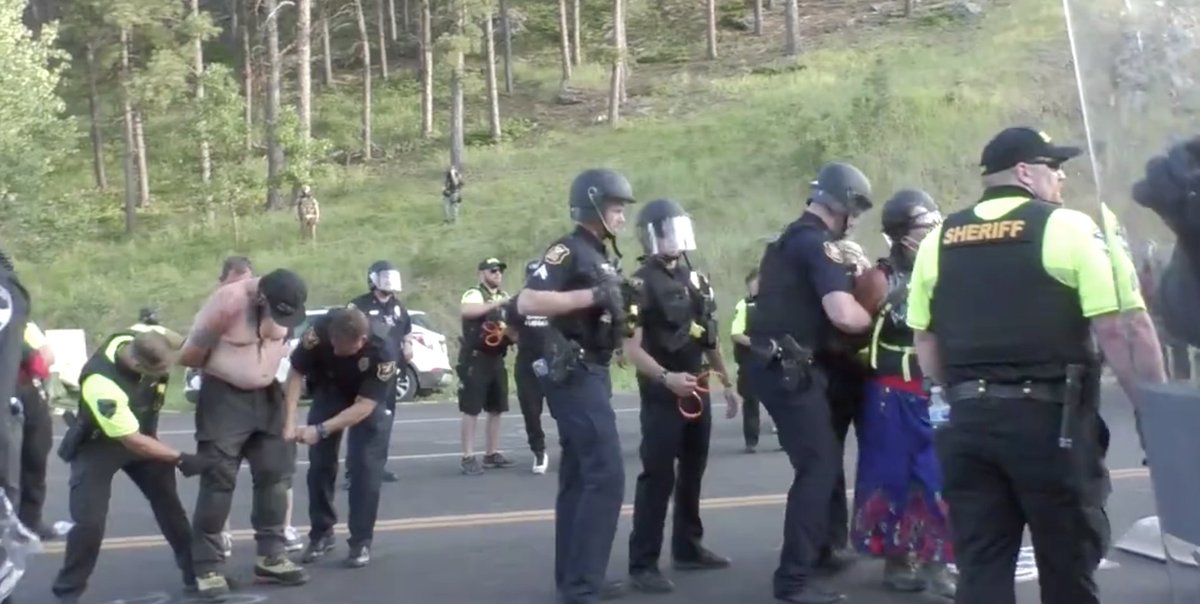 Arrests have begun at Mount Rushmore to cries of "You stole this land! You stole this land!"