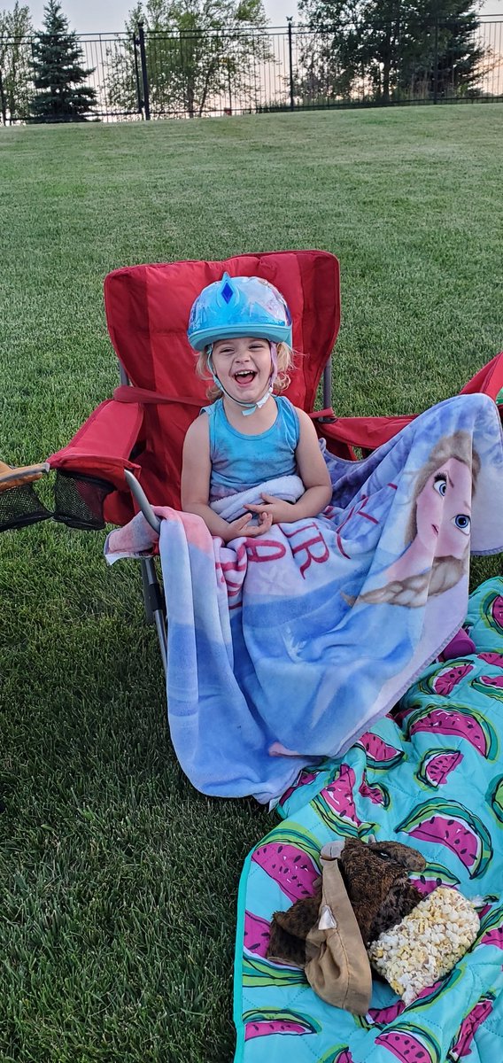 dpblack's tweet photo. #Frozen2 at #Sumtur Amphitheater with Luna who is wearing her #Frozen bike helmet and her blanket. Beautiful night in #Papillion- while socially distanced https://t.co/9BCB5VcqNG