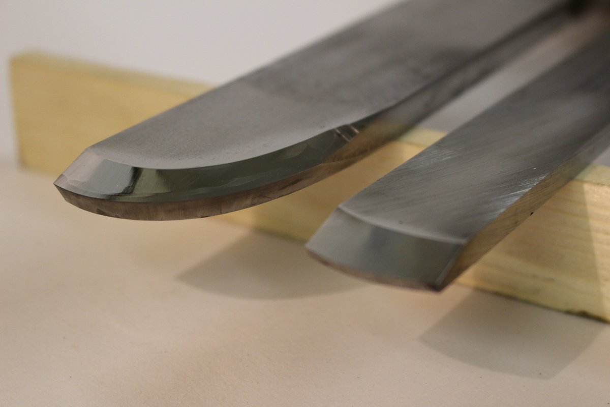 Step 6 - Re-grind the tool upside down to draw the burr off the cutting edge at the intersection of the two faces. The top bevel is not -re-ground. The top "bevel" should be highly polished.