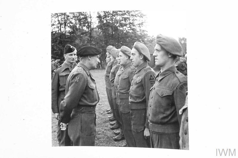 #DDay76 - Birmingham lad, Rifleman Michael Kevin ‘Sticky’ Ryan had enlisted with 2/RUR aged just 19 in 1925. Ryan had been awarded the MM for his actions at Ypres in 1940. Photographed here in a marshalling camp in May 1944 near Portsmouth speaking with Montgomery.