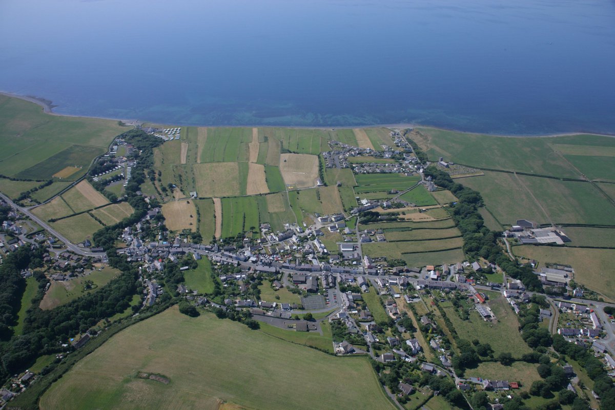 Between a tiny Ceredigion village and the sea lies an area of flat land, bordered by the rivers Peris and Cledan.On maps, it's called Morfa Esgob (Bishop's Land).It's strangely divided into long strips.This land is ancient.They call it Lleiniau—the Llanon Slangs.THREAD 