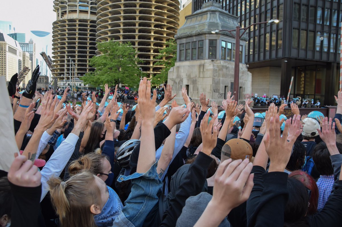 what was going on and retain the truth/historical value of the event while keeping the safety of those involved in mind. This is one of my favorite examples of this. It shows crowd size, location, method of protest without showing a full face anywhere. (6/9)