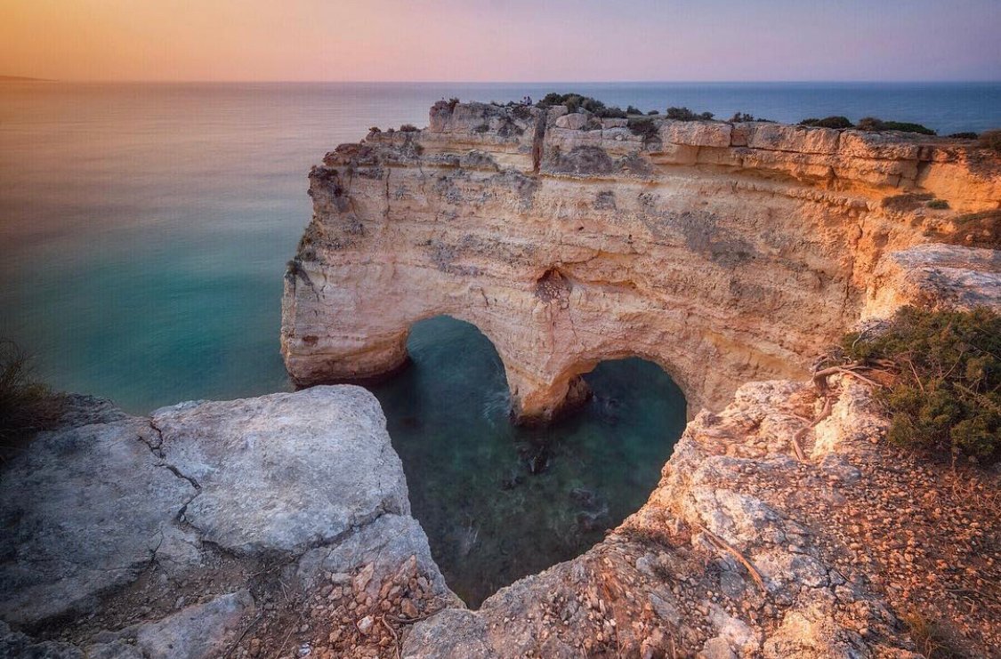 Mycolloseum_com's tweet photo. 💙#nature 
We can't wait to travel! 
Photo by @reubenfields 
#heart #naturalarchitecture #sea #ocean #portugal #cliff #landscape #algarve #travel #visitportugal #mycolloseum #sunrise #travelgram https://t.co/IZ5XAzzJJT