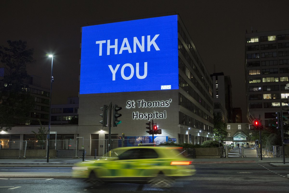 An image of blue light projected onto St Thomas' Hospital with white writing that says "THANK YOU".