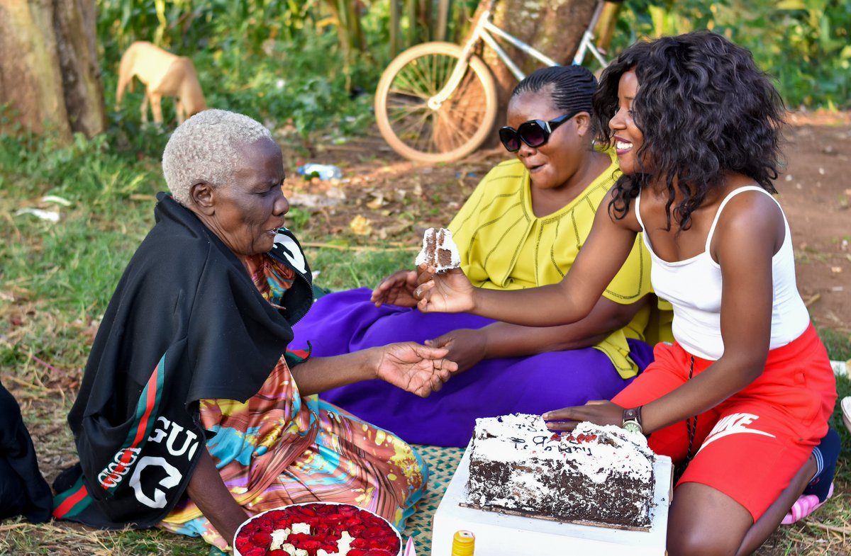 CultonScovia's tweet photo. Jajja Robinah is blind but we cut the cake together. I fed her https://t.co/1eeLn7ET6N