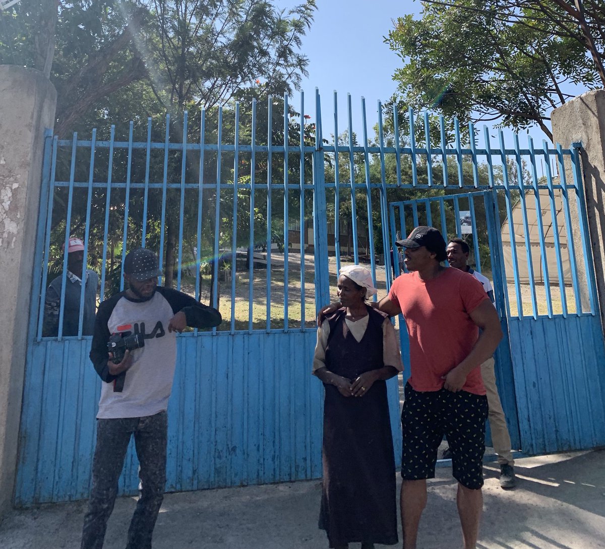 henokgabisa's tweet photo. Kenyan journalist @Yassinjuma⁩ on the left with his sharp camera lens catching the moment we run into this lady who works $30/month in a kitchen of a middle school in Bishooftuu town. Yassin cried with her after hearing her story. #ReleaseYassin ⁦@CPJAfrica⁩ https://t.co/kj8Kn4wgjJ