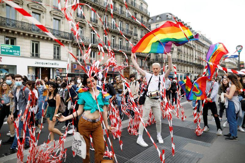 Reuters's tweet photo. LGBT Pride activists protest in Paris against racial injustice https://t.co/OEoVNLUx1T https://t.co/IkOoiOQAig